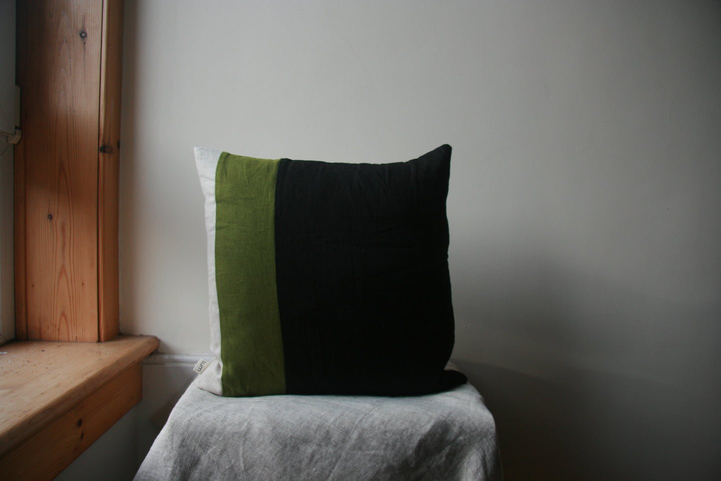 Striped cushion cover. From L-R: narrow natural linen stripe, thicker green stripe, wide black stripe panel.