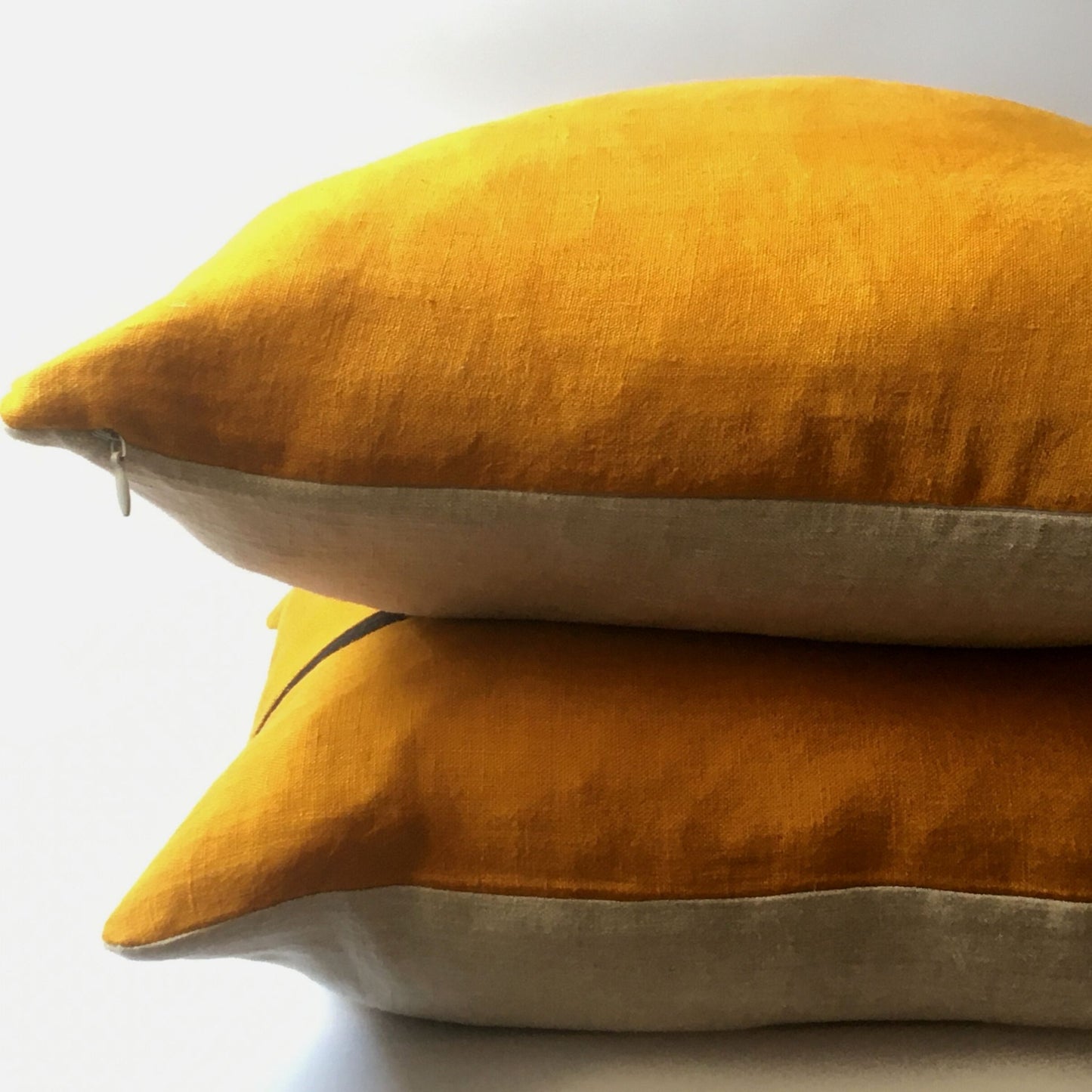 two yellow cushions stacked