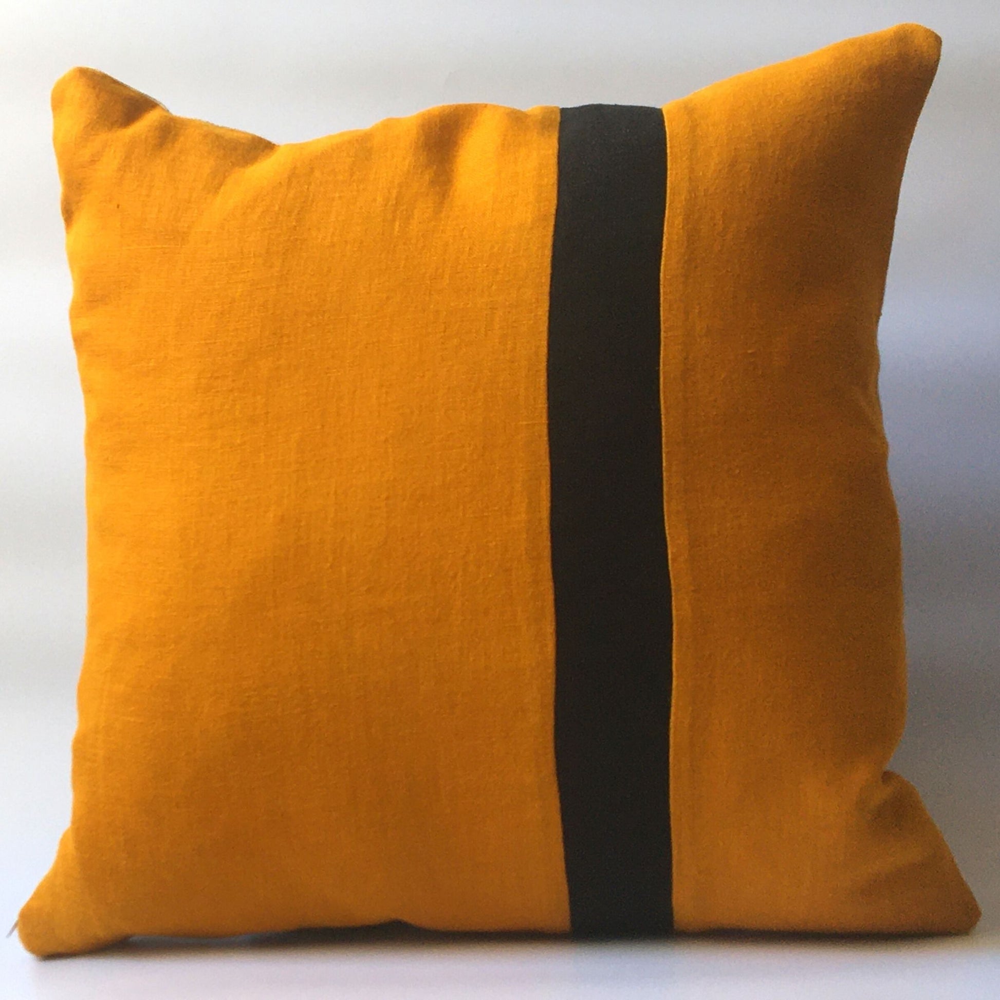 yellow cushion cover with black stripe