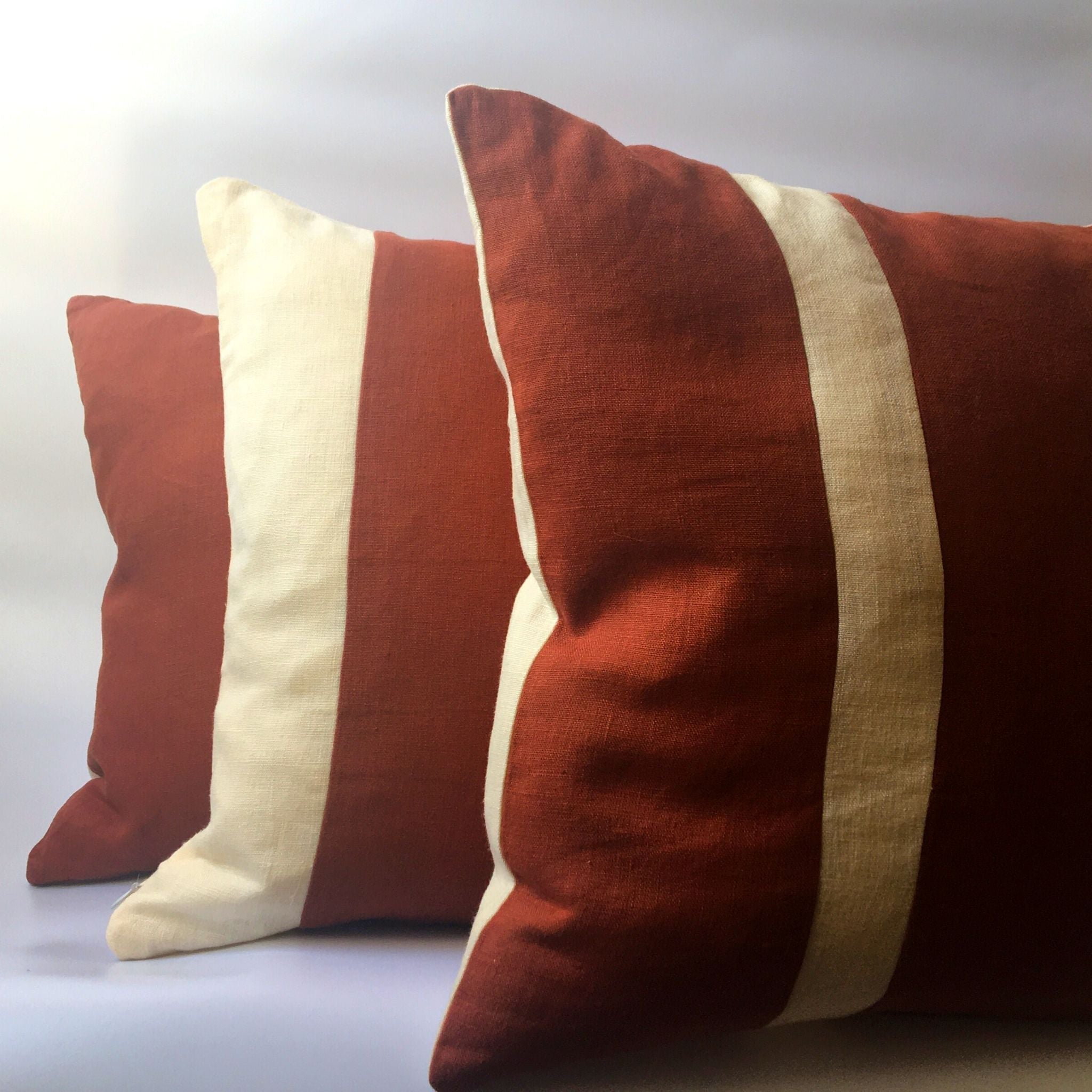 Red and hot sale beige pillows